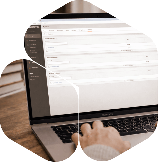 Close-up of a person using a laptop, interacting with software on the screen