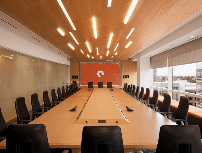 Modern Conference Room with Wooden Ceiling and Large Table