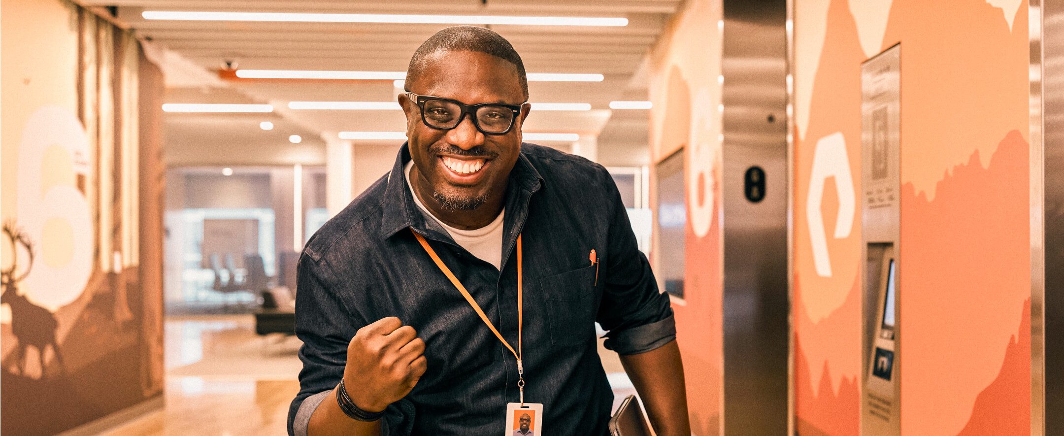 Excited man celebrating success in an office environment