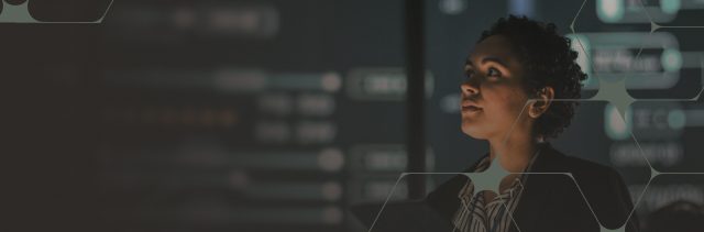 Woman engaged in data analysis within a modern tech setting