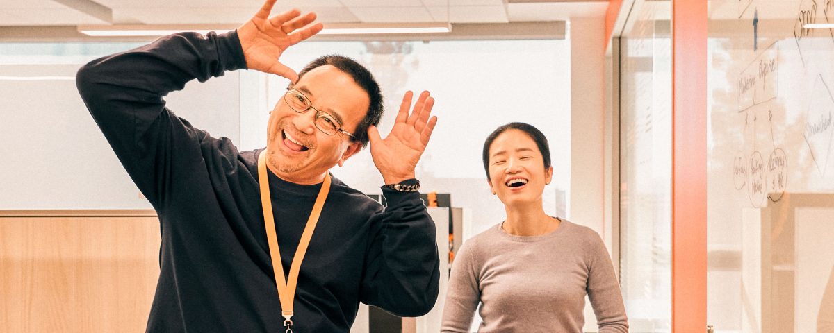 Two colleagues having fun in an office environment