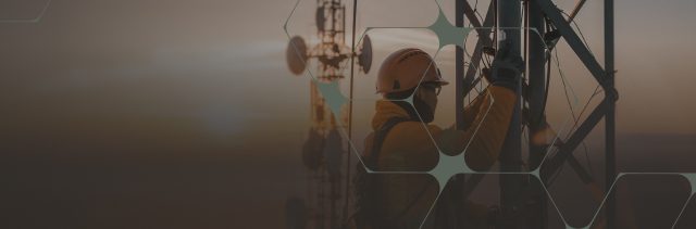 Telecommunications Worker on Tower at Sunset