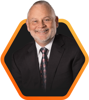 Smiling professional in a suit against a dark background