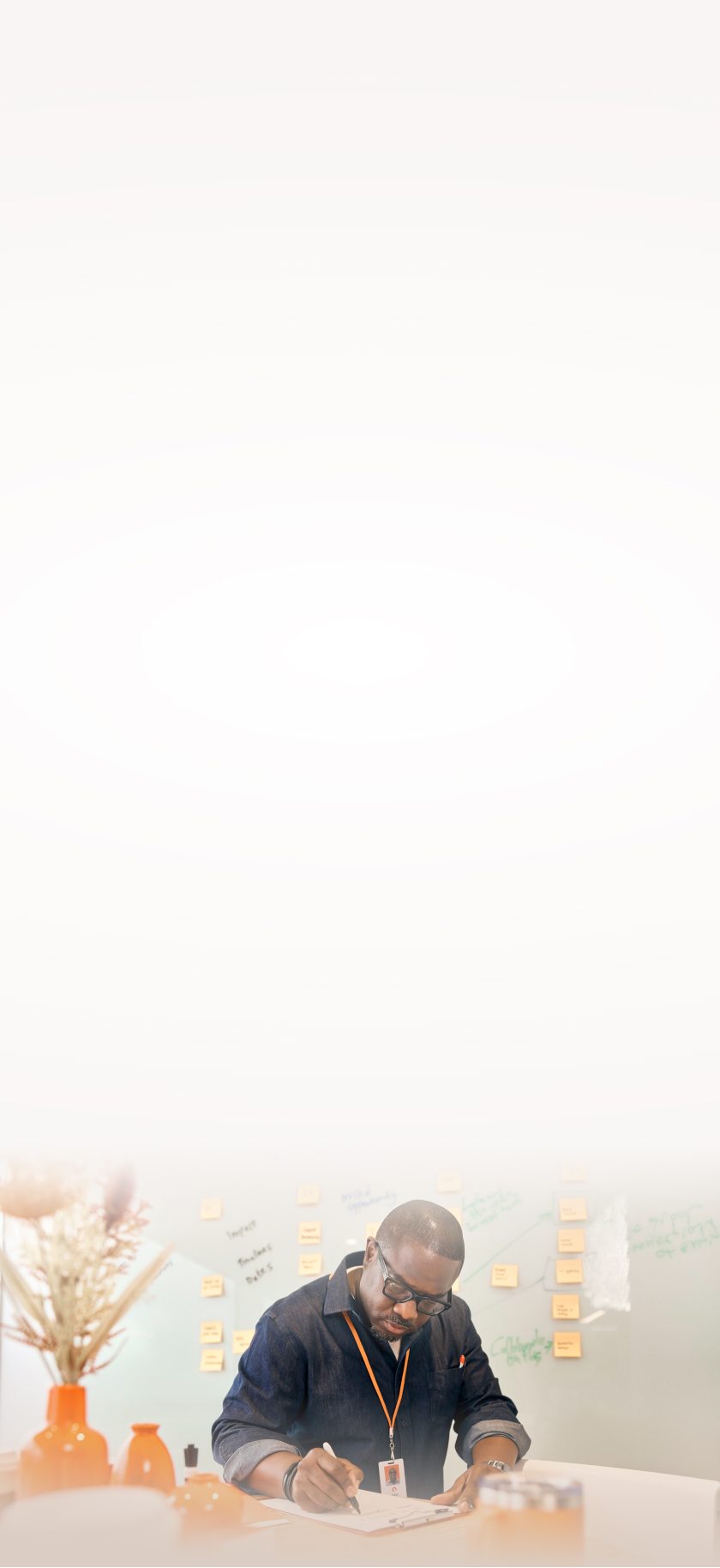 Individual Engaged in Creative Brainstorming with Notes and Papers