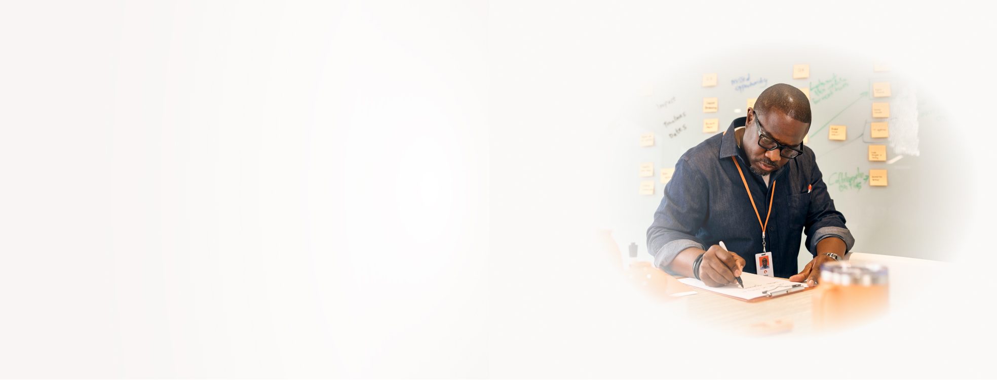 Individual Engaged in Creative Brainstorming with Notes and Papers