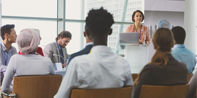 Audience Listening to a Speaker in a Modern Conference Setting