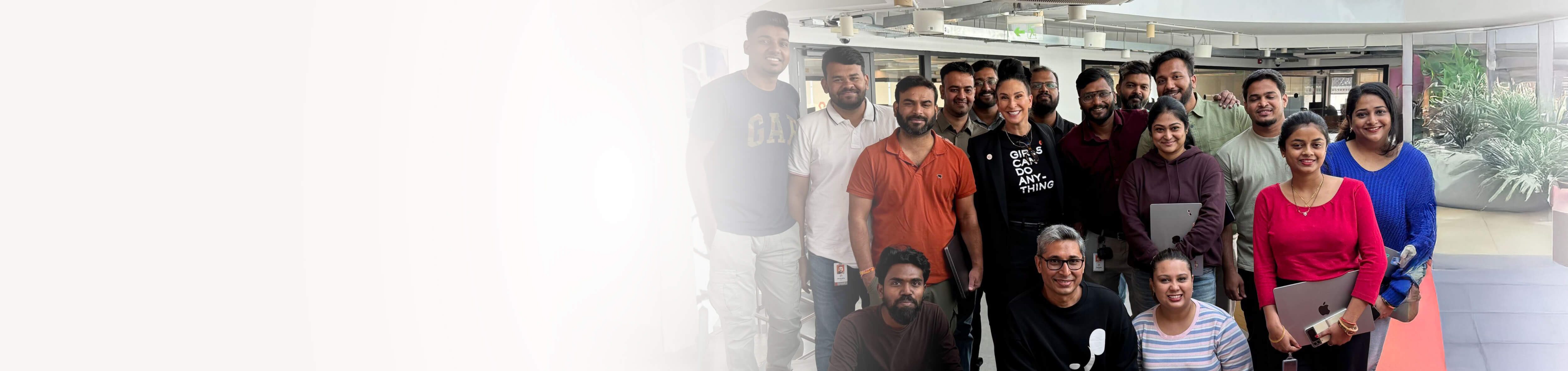 Group photo of a diverse team in a professional setting